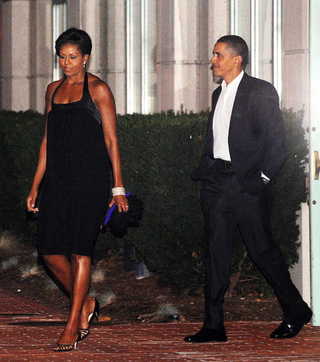 Show ’em what you got: First lady Michelle Obama, wearing Narciso Rodriguez, and President Barack Obama in Washington, D.C., celebrating their 17th wedding anniversary on Oct. 3, 2009.Olivier Douliery-Pool/Getty Images
